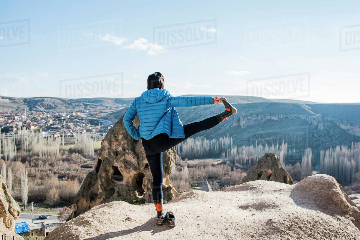 Woman practising yoga in Selime Monastery, Göreme, Cappadocia, Nevsehir, Turkey Royalty-free stock photo