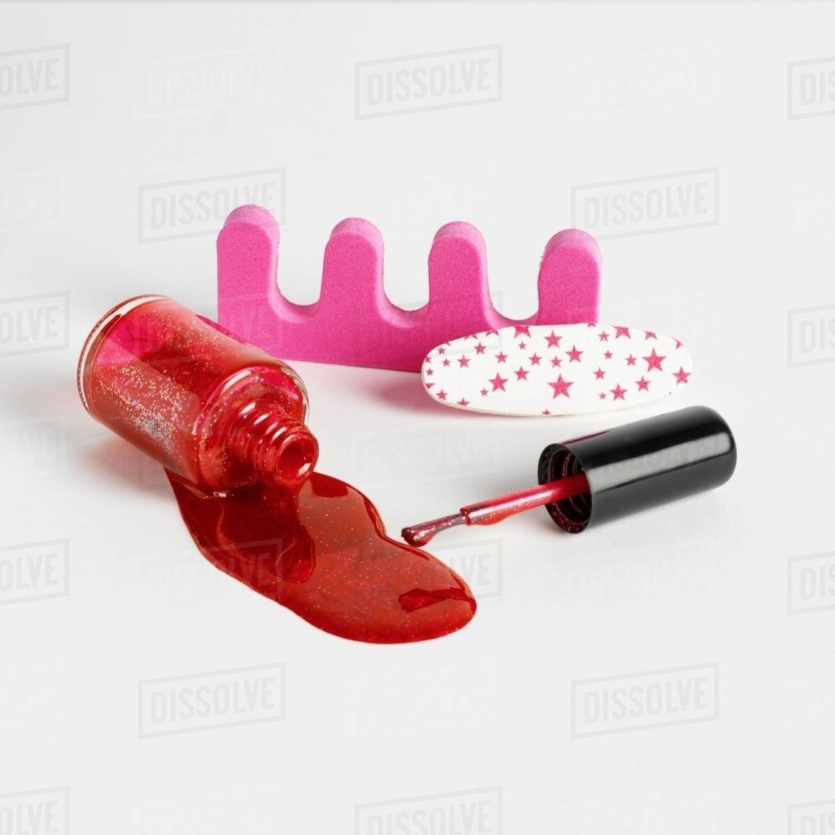 Toe separators and red nail varnish Stock Photo Dissolve