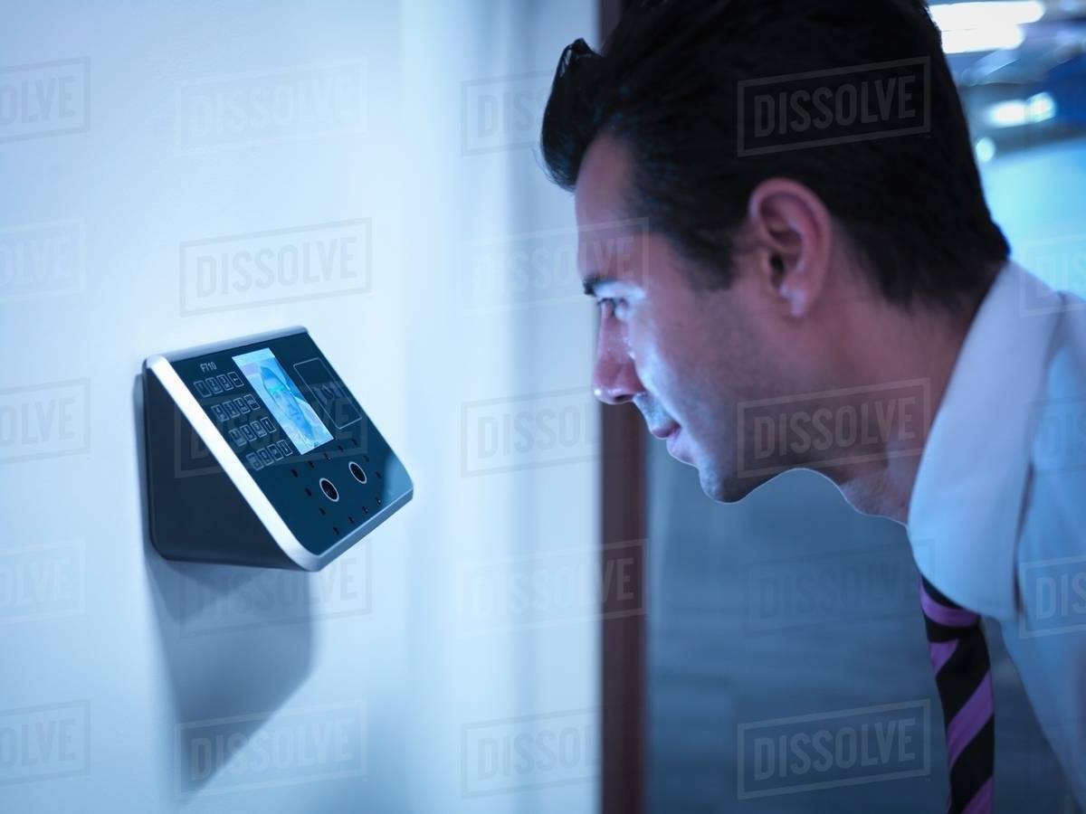businessman using face recognition system for office security