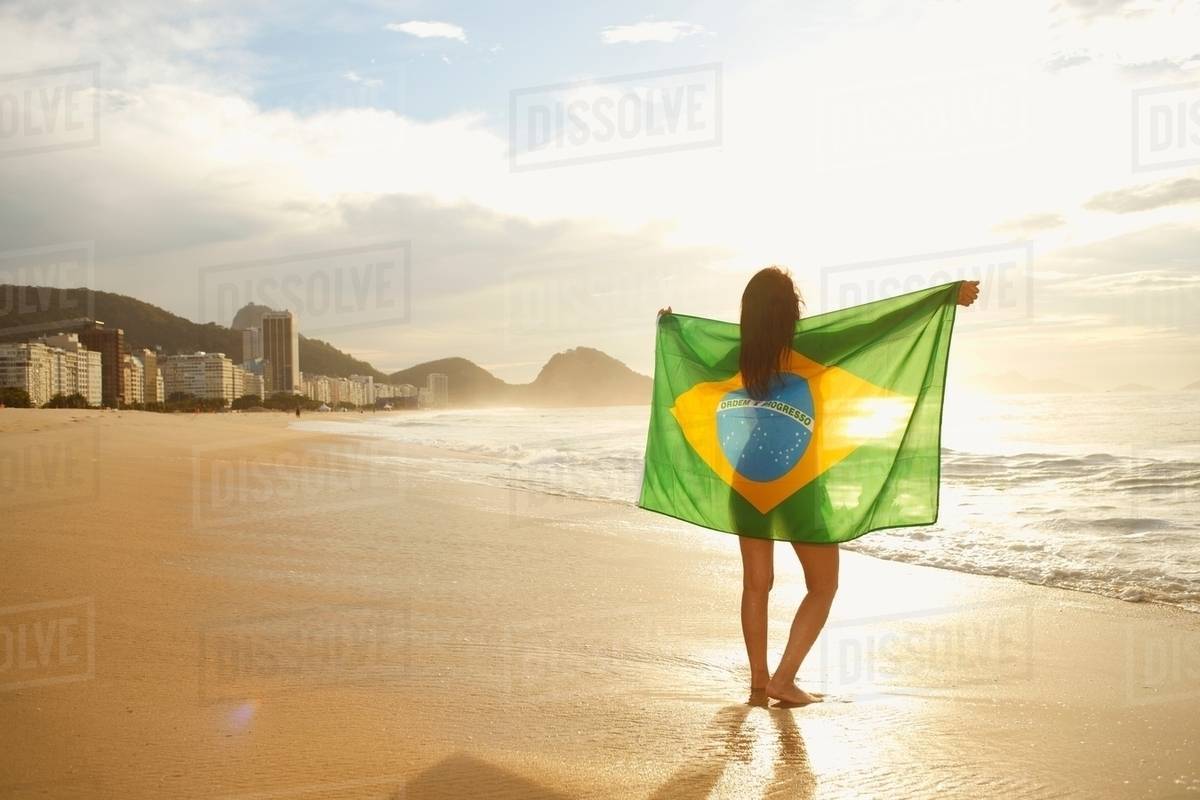 Woman Holding Brazilian Flag On Copacabana Beach Rio Brazil Woman Holding Brazilian Flag On Copacabana Beach Rio Brazil
