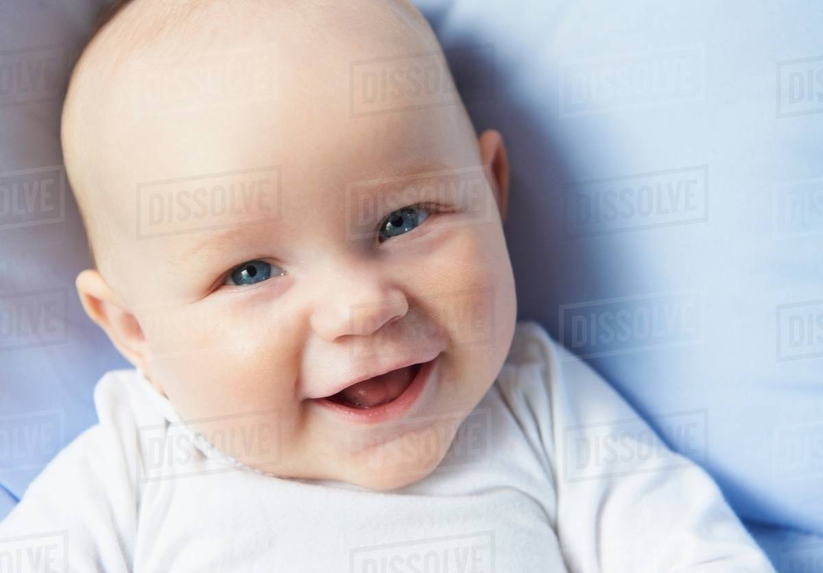 Close up of infants laughing face Stock Photo Dissolve