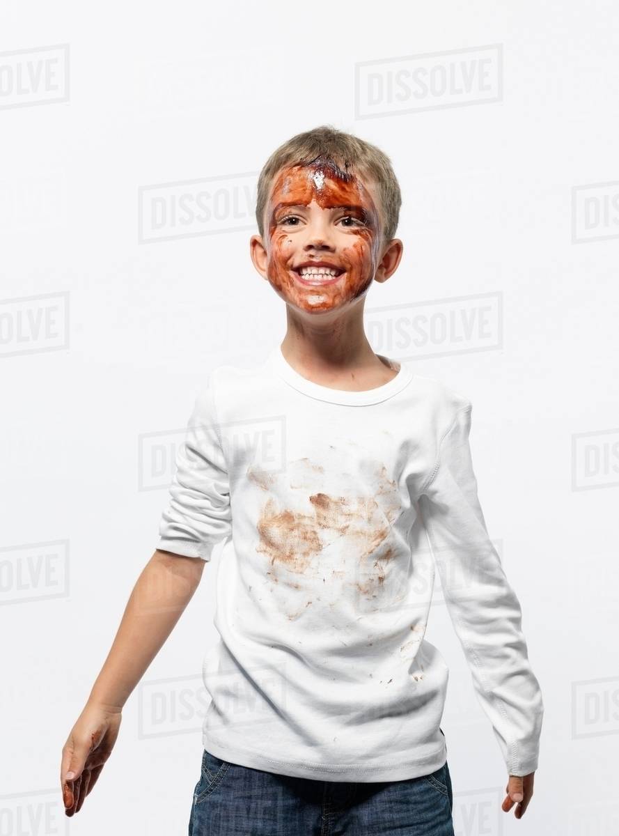 Boy covered in chocolate sauce Stock Photo Dissolve