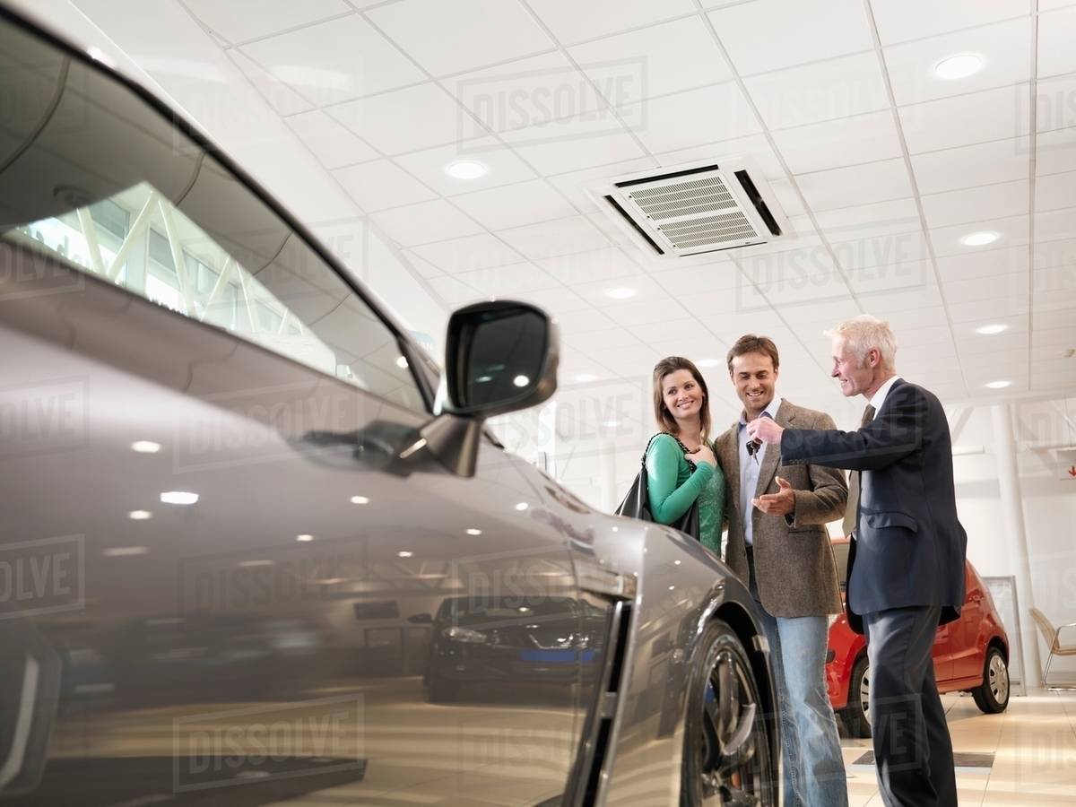 Key Car Dealership >> Salesman Handing Customers Keys To A Car In Car Dealership D943 93 418 Key Car Dealership >> Salesman Handing Customers Keys To A Car In Car Dealership D943 93 418