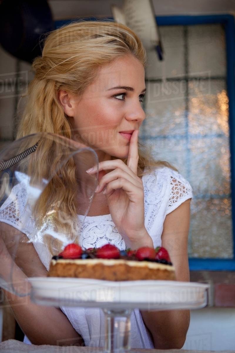 Girl with strawberry cake Stock Photo Dissolve