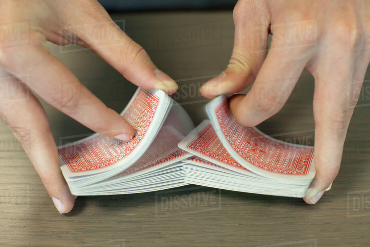 Hands shuffling cards Stock Photo Dissolve