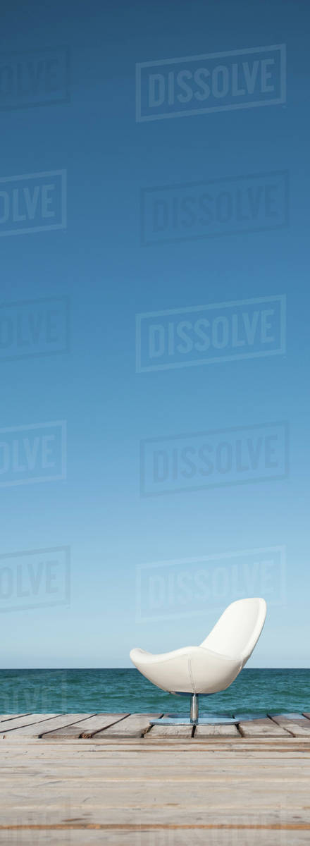 Chair on dock - Stock Photo - Dissolve