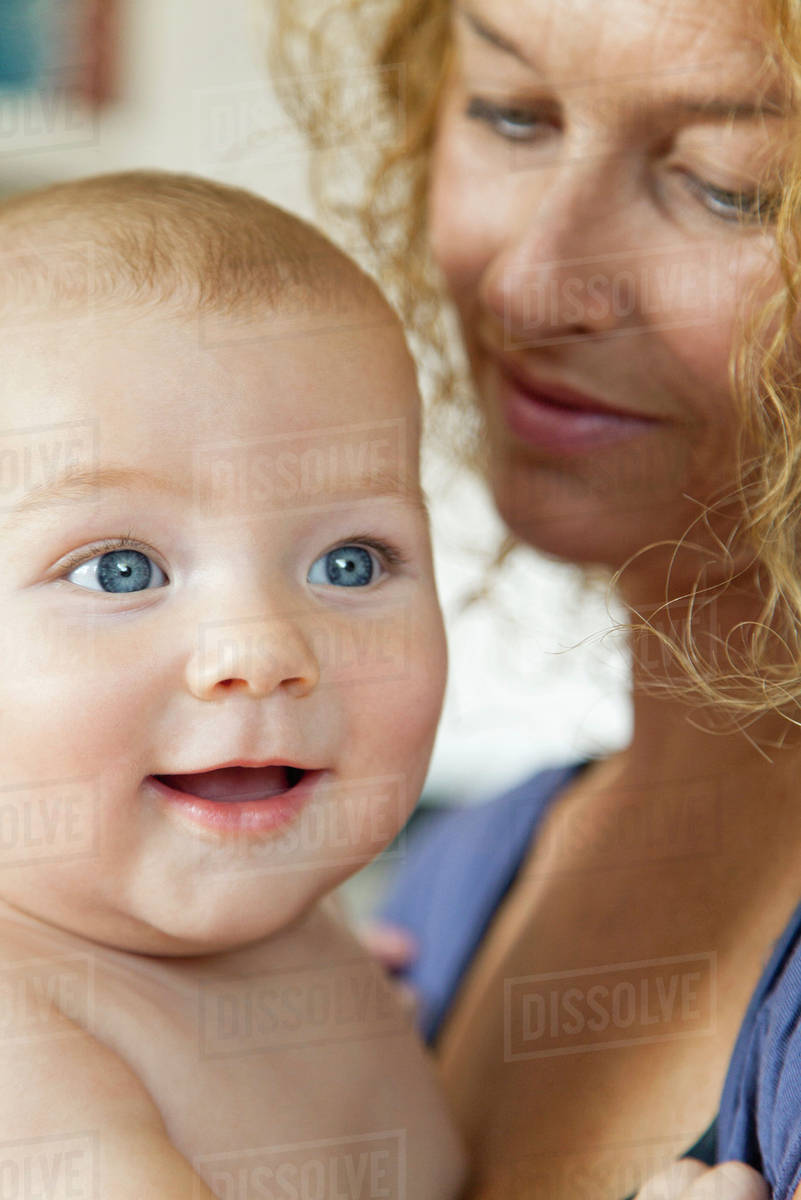 Mother holding baby Stock Photo Dissolve