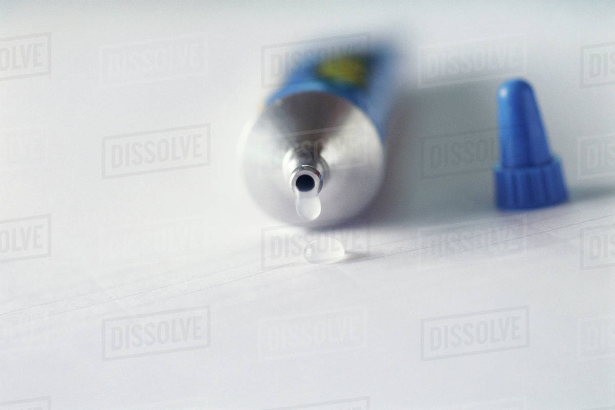 Tube of glue Stock Photo Dissolve