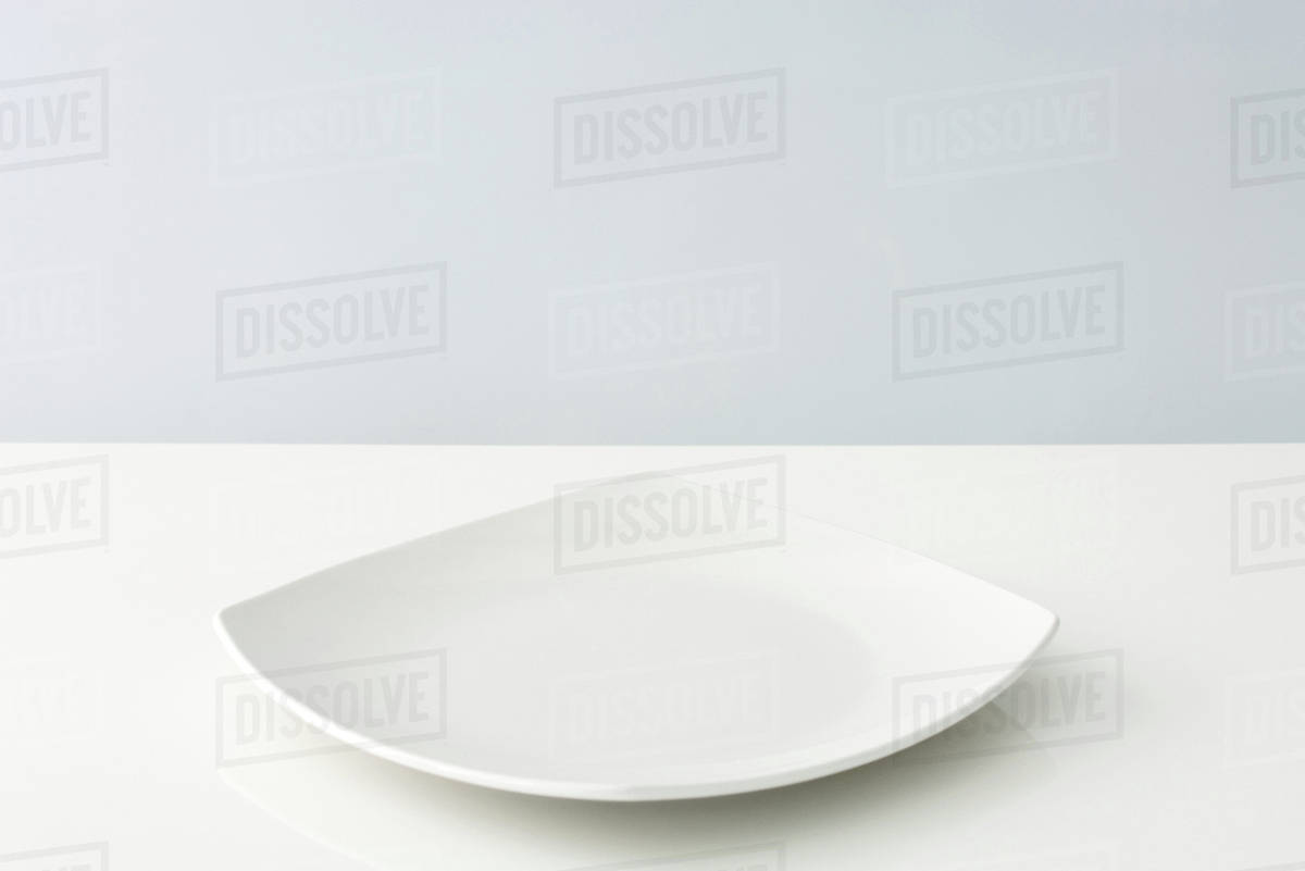 Curved plate, closeup Stock Photo Dissolve