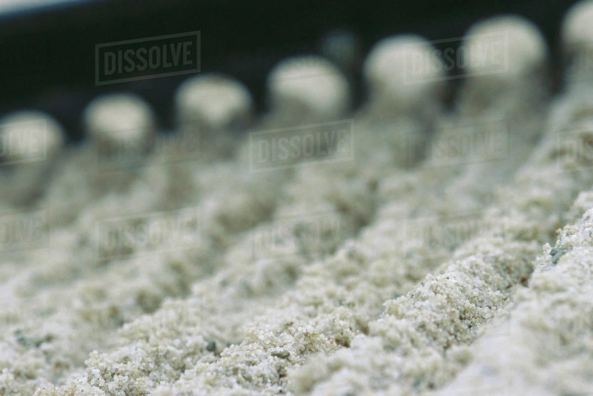 Raking sand trap, extreme closeup Stock Photo Dissolve