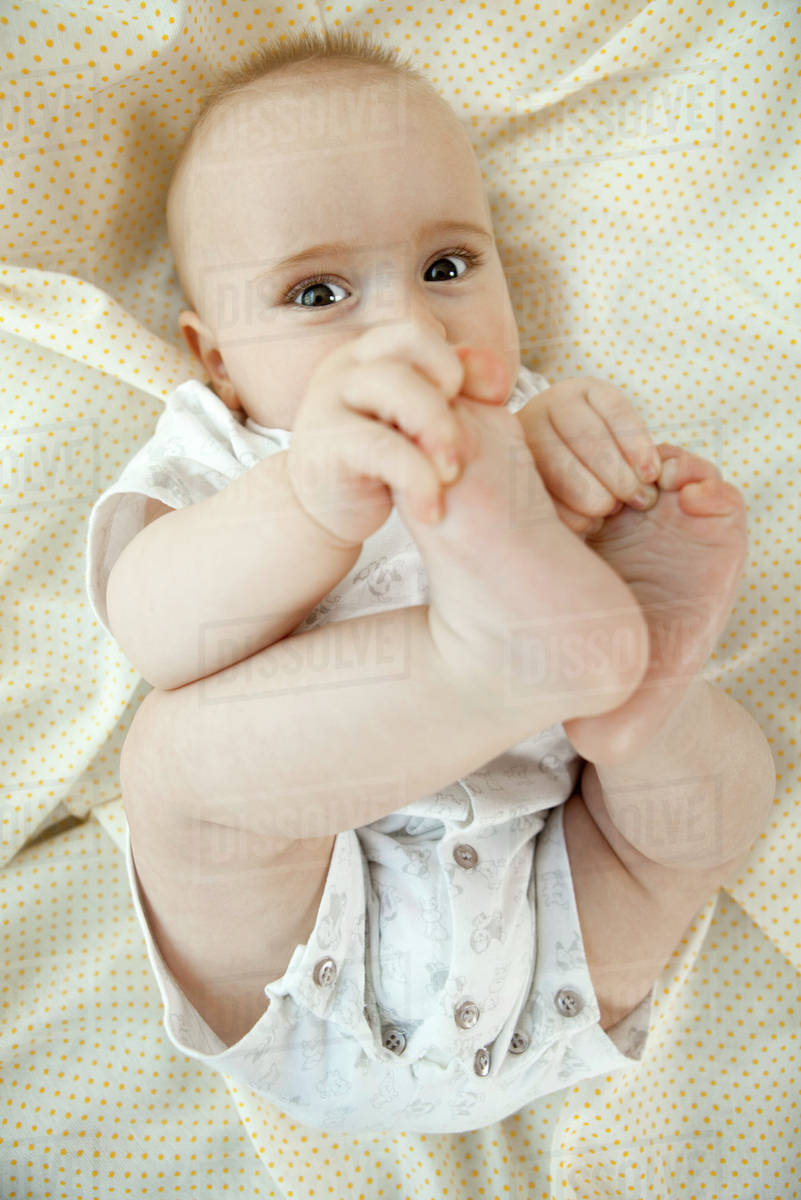 baby touching its toes