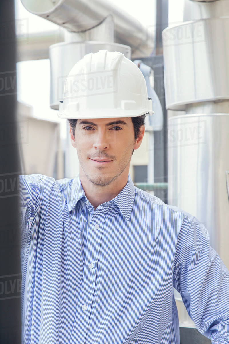 Engineer at industrial site, portrait Stock Photo Dissolve