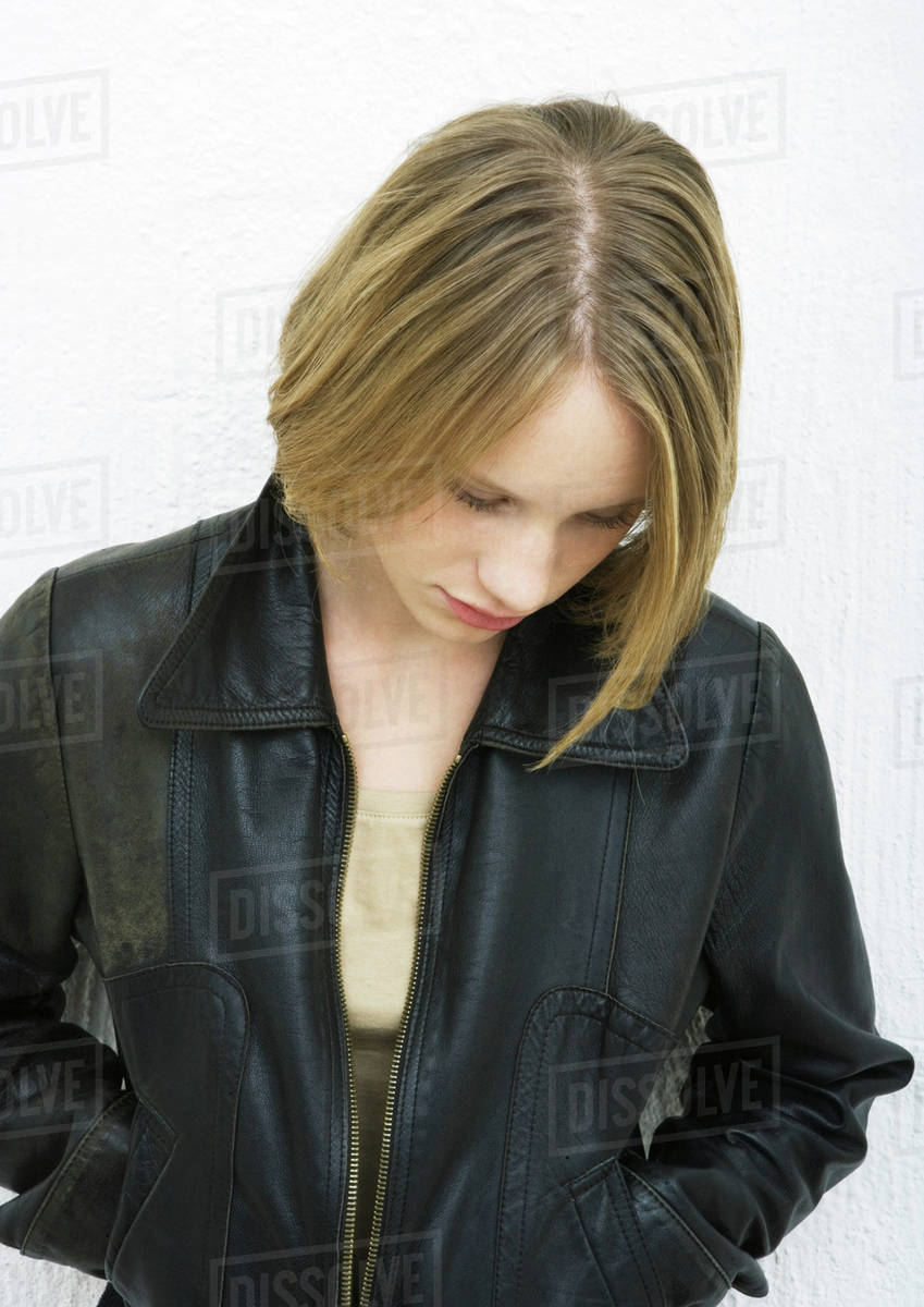 Teenage girl, head down, portrait Stock Photo Dissolve
