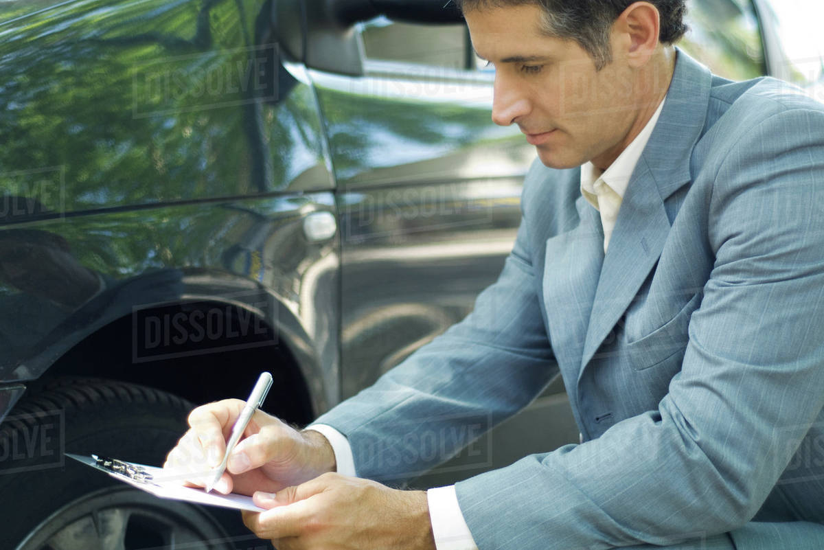 insurance adjuster inspecting car stock photo dissolve automotive insurance adjuster