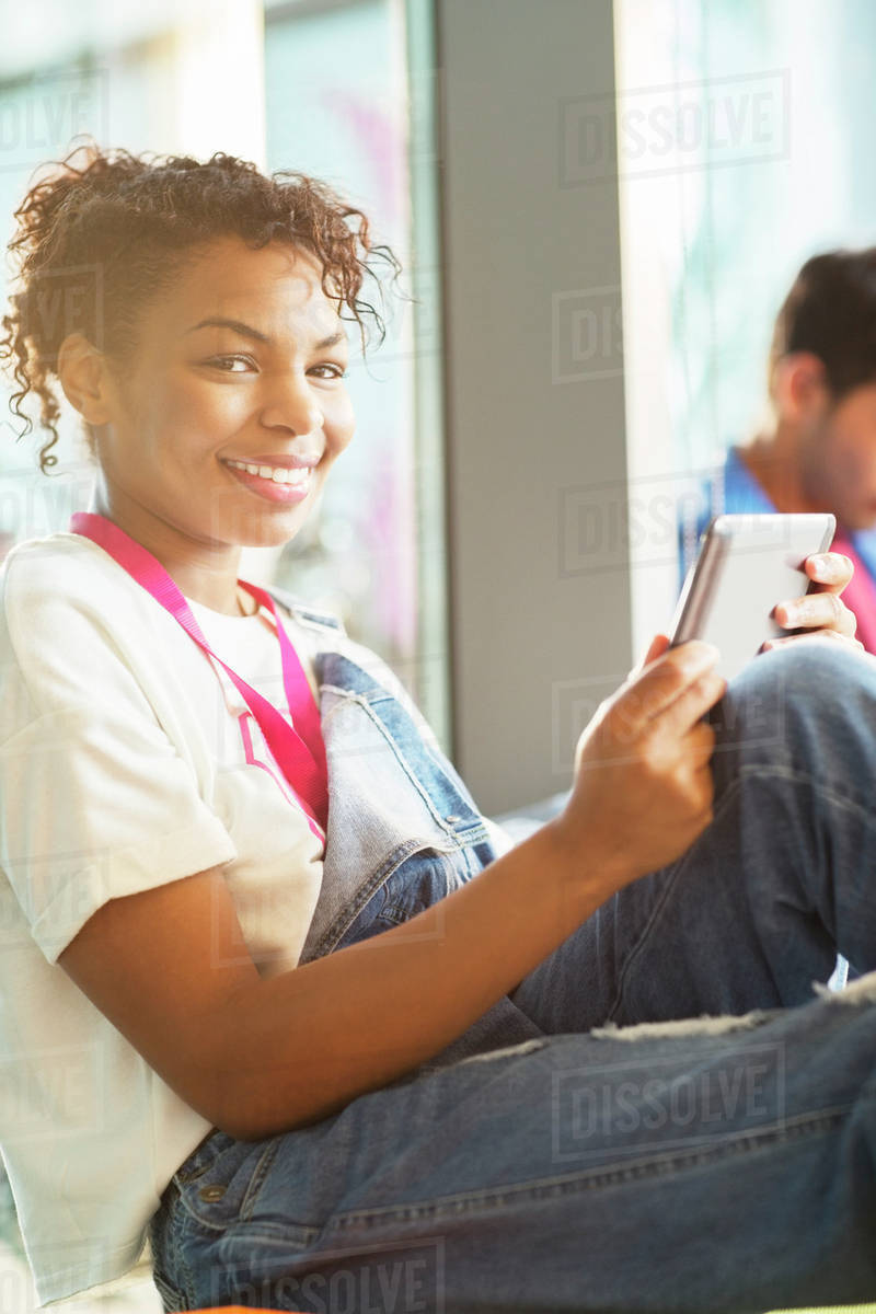 University student using digital tablet Stock Photo Dissolve