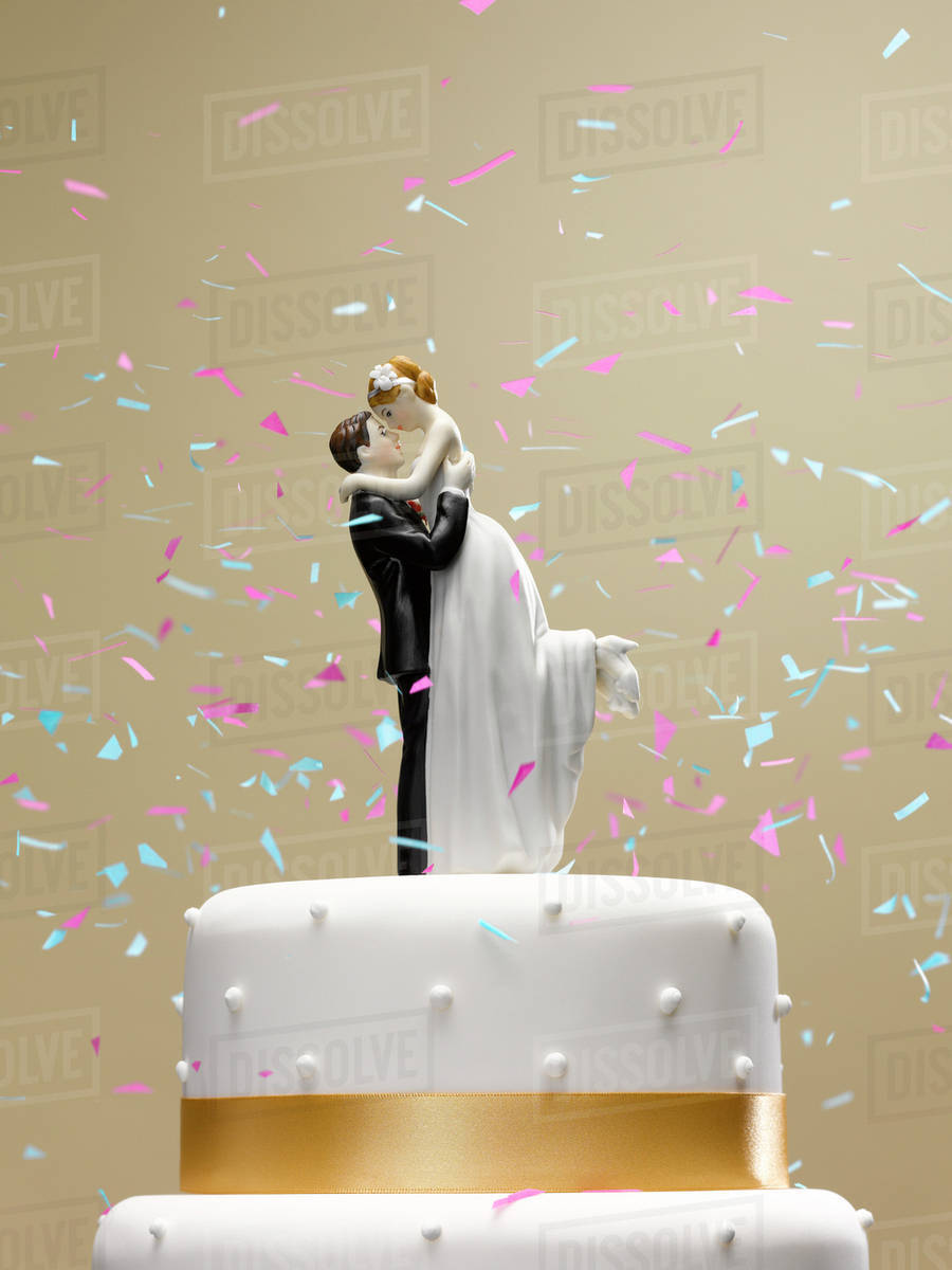 Confetti Falling On Wedding Cake Stock Photo Dissolve Confetti Falling On Wedding Cake