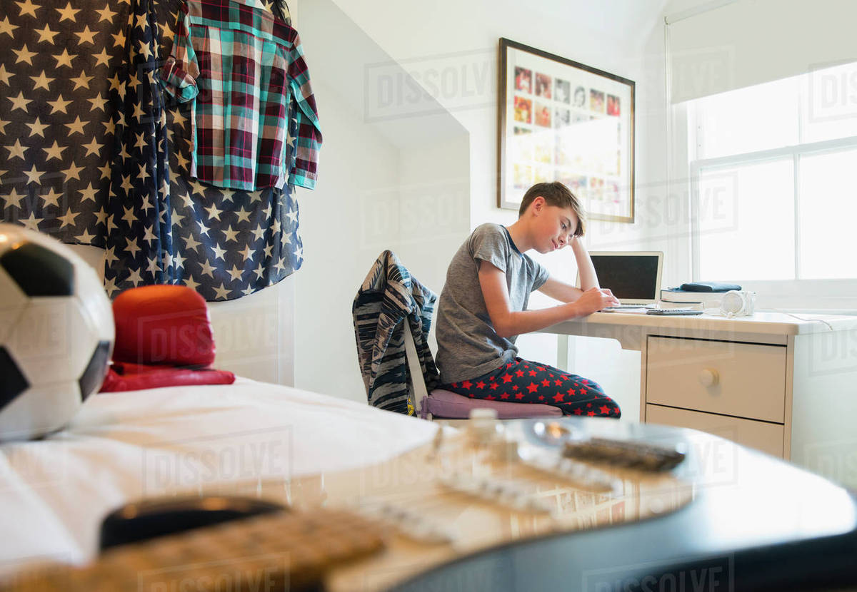 Bored Boy Doing Homework At Desk In Bedroom D985 40 284 Bored Boy Doing Homework At Desk In Bedroom D985 40 284