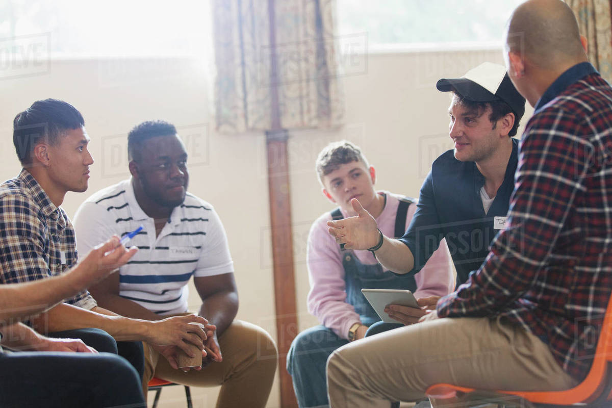 Men talking n group therapy circle Stock Photo Dissolve