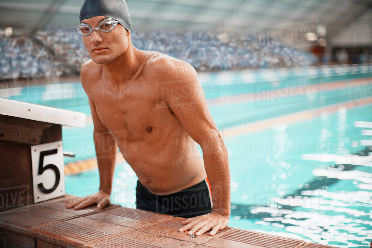 Swimmer getting out of pool Stock Photo Dissolve