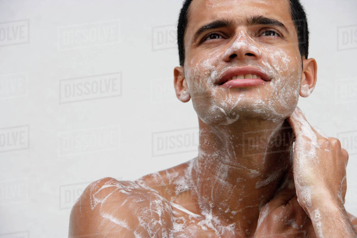 Man covered in soap suds Stock Photo Dissolve