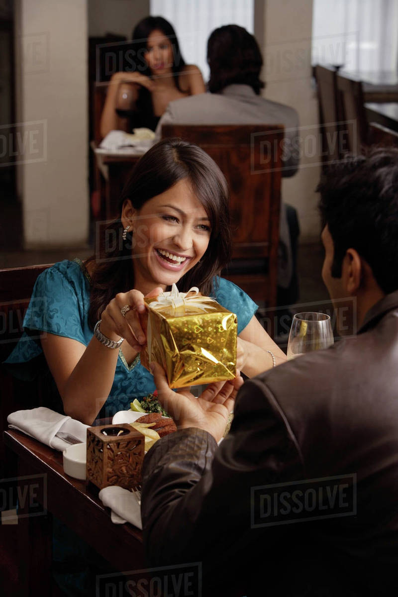 Young Man Giving Present To Woman Stock Photo Dissolve Young Man Giving Present To Woman