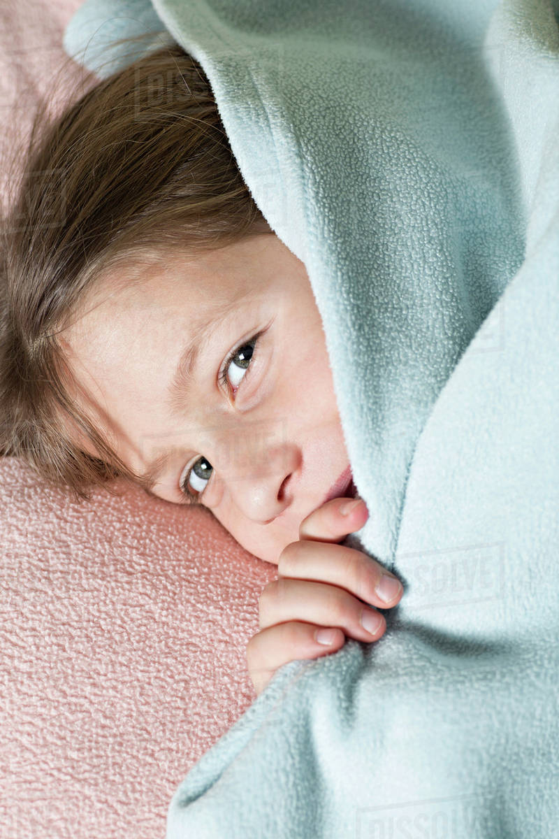 Girl under blanket Stock Photo Dissolve