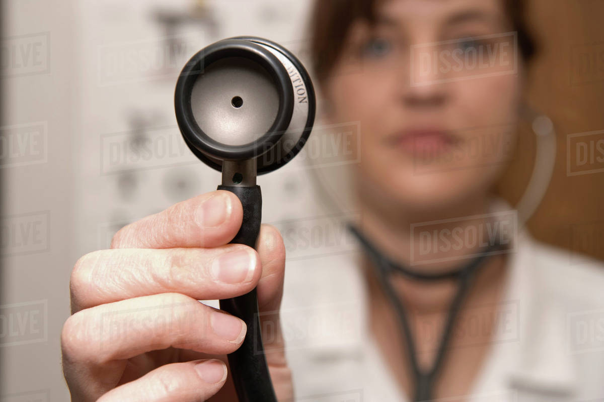 A doctor using a stethoscope Royalty-free stock photo