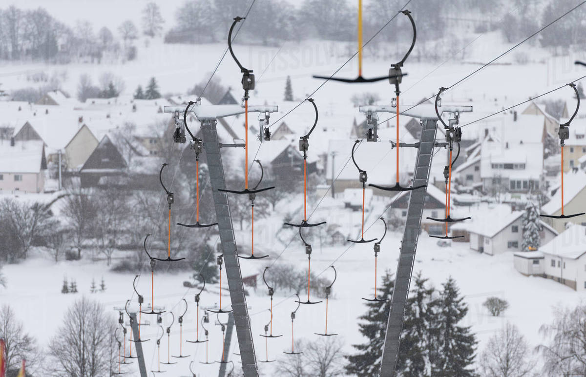 Ski lift cables with ski resort in background, RoemersteinDonnstetten