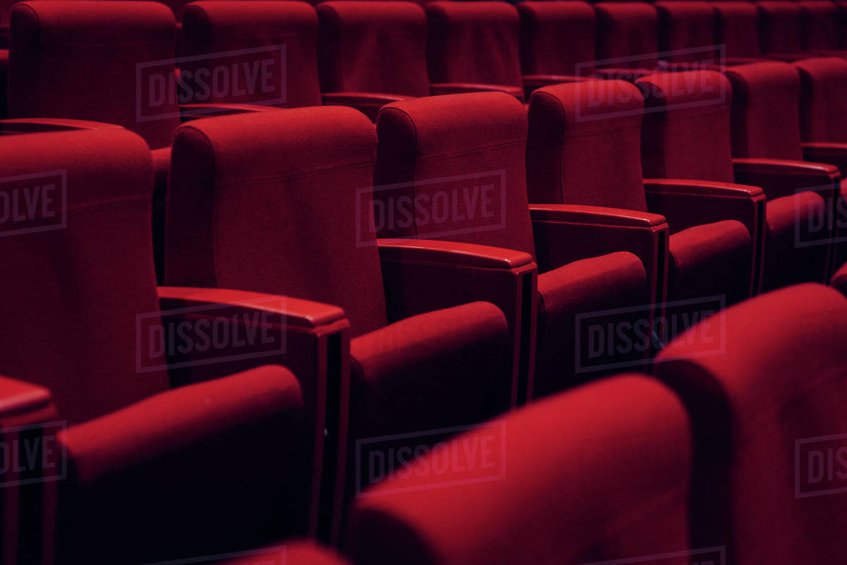 Red theater seats in a row Stock Photo Dissolve