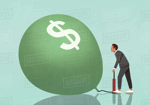 Businessman inflating dollar sign balloon with tire pump - Stock Photo ...