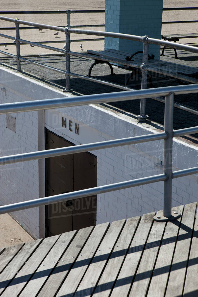 A men's public restroom on the beach at Coney Island, USA Stock Photo