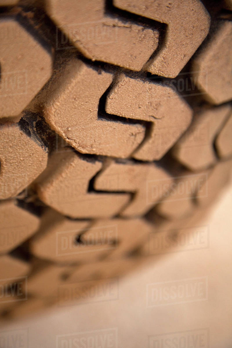 Extreme close up, muddy tire tread Stock Photo Dissolve